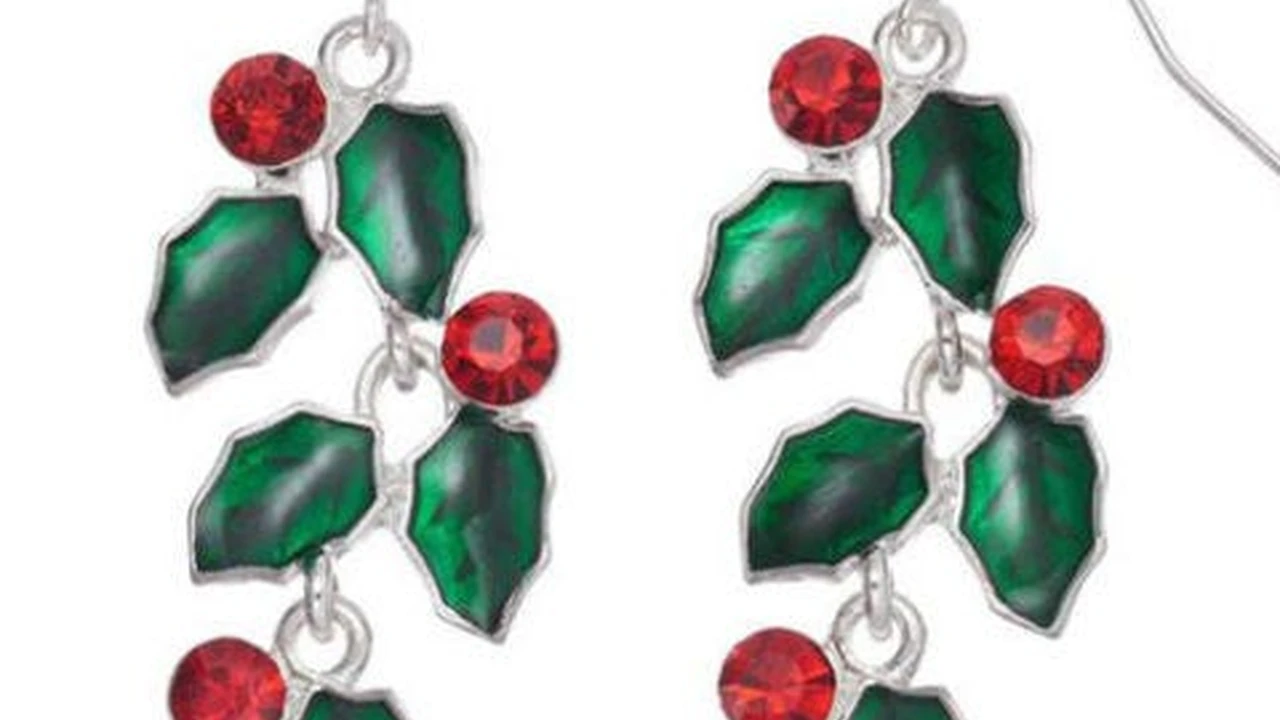 Close up on a plate of mashed potatoes, topped with baked pork chops with cream of mushroom soup, and a side of green beans.