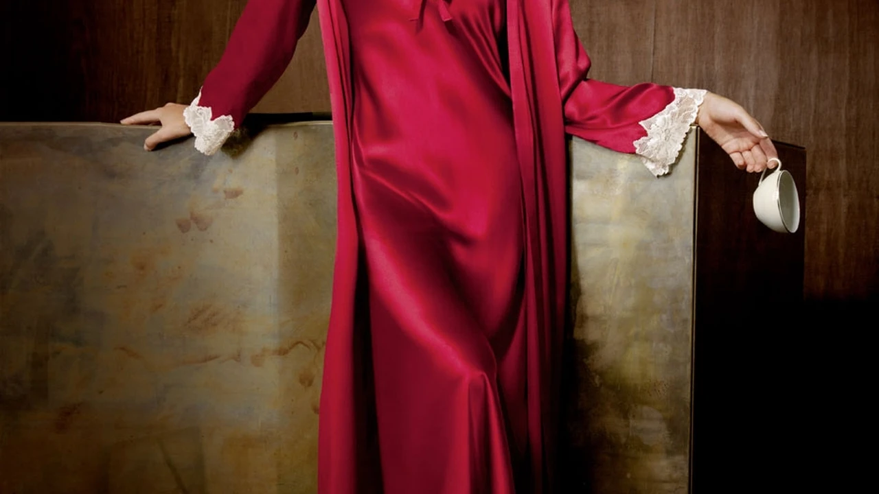 overhead view of corned beef sliced and on a platter with cabbage, potatoes, and carrots