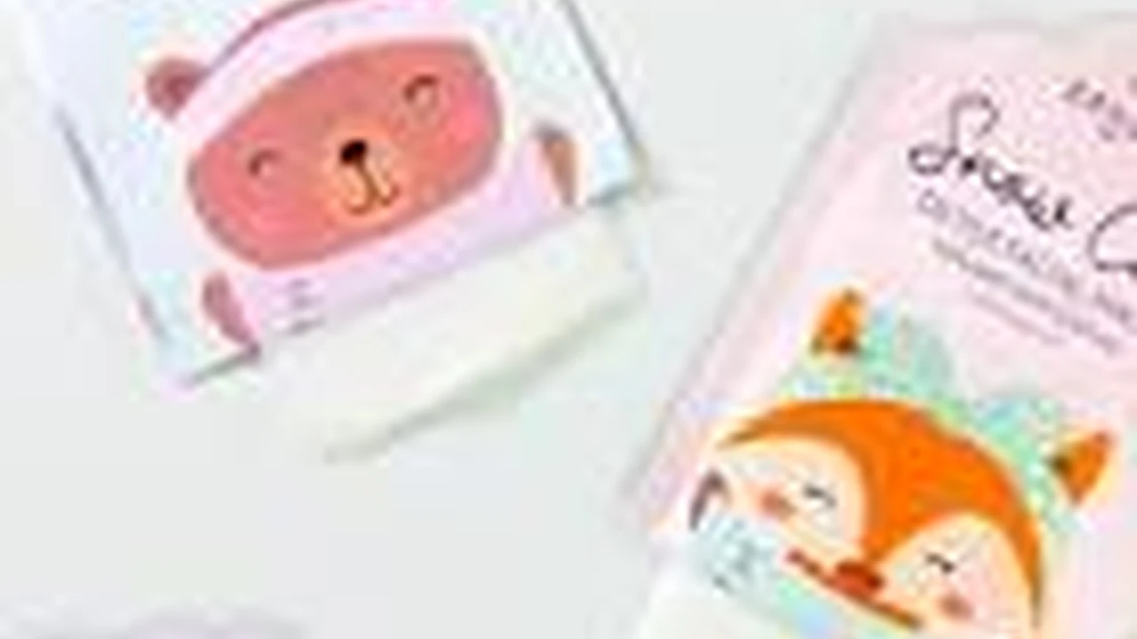 Two mint chocolate milkshakes with whipped cream and green sprinkles.