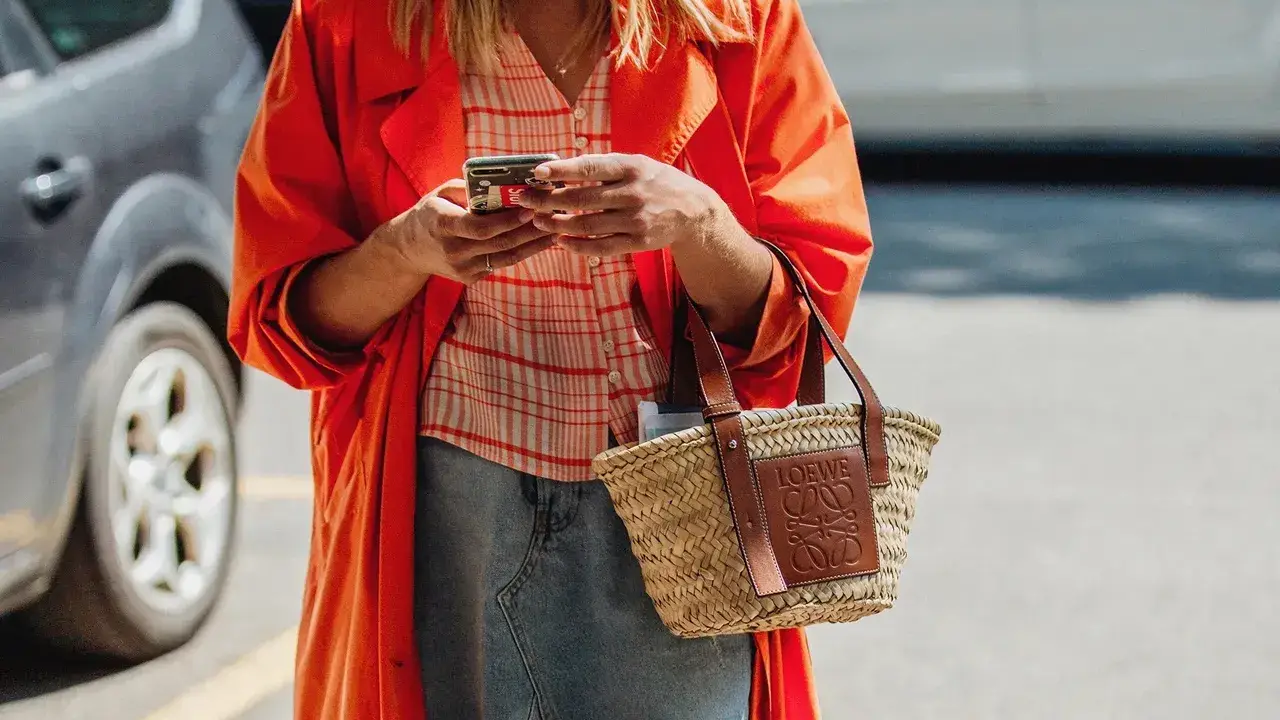 Close up on a plate of mashed potatoes, topped with baked pork chops with cream of mushroom soup, and a side of green beans.