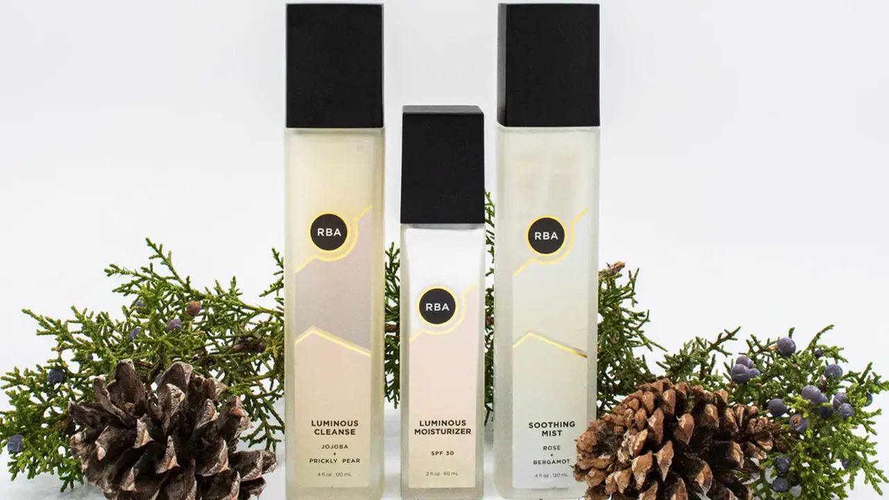 Close up on a plate of mashed potatoes, topped with baked pork chops with cream of mushroom soup, and a side of green beans.